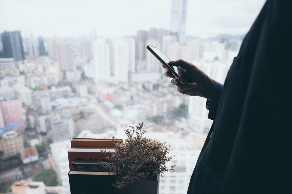 A person holding a mobile phone